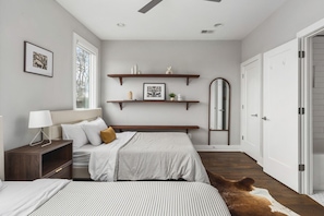 Bedroom #2 with two queen beds, a closet, and full-length mirror, attached to the jack-and-jill bathroom.