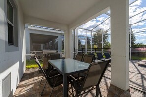 Relax and dine al fresco on this private patio with a grill and garden views, perfect for enjoying sunny days.