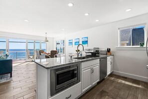 While cooking a traditional Maine Lobster Bake, you can catch the waves and enjoy the sea breeze. 