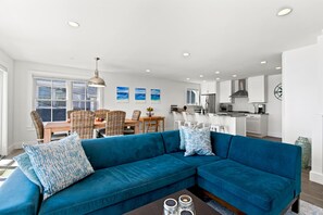 Large open concept living, dining, and completely updated kitchen.
