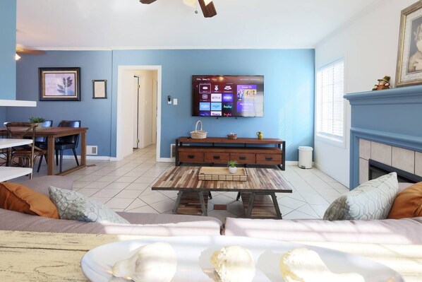 Living room area w/ 60 inch Smart TV