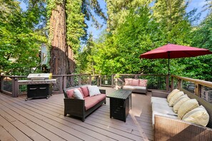 Wrap yourself in the ambiance of the forest while unwinding on our hillside deck with a firepit.