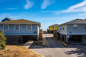 East view from front porch, direct beach access to the left of the yellow house.