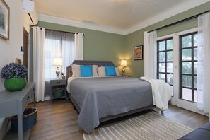 The soft lighting and comfortable bedding create a relaxing atmosphere.