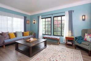 Unwind in this bright and colorful living space featuring cozy seating.