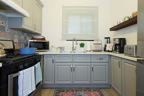 Feel right at home in this cozy, well-equipped kitchen perfect for cooking.