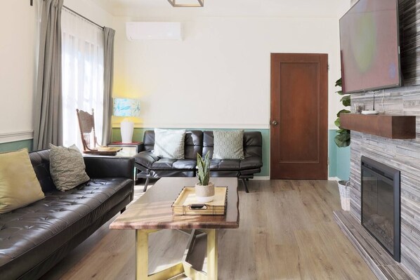 Living area w/ 60 inch Smart TV