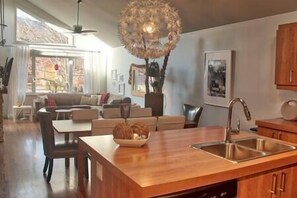 Open-air kitchen and living room with a view of Mont Ste-Anne