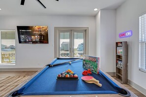 Rack 'em up for a friendly game of pool in our game room retreat