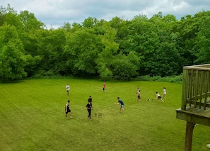 Playing your favourite game in the HUGE backyard. Spikeball, anyone?