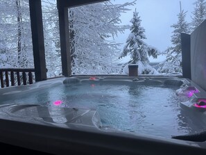 Soak in the private hot tub