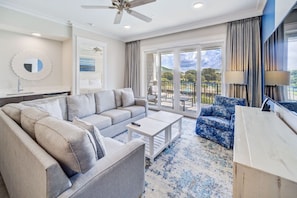 A plush living area with a soothing palette that echoes the tranquility of the sea.