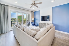 A contemporary space where comfort meets chic, accented by cool ocean tones.