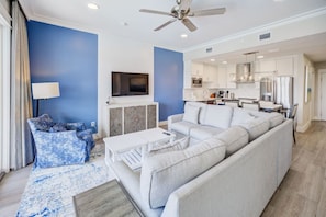 The perfect blend of living and dining, set against a backdrop of calming blues.