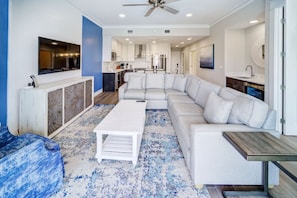 A spacious living area that extends into the dining space, designed for relaxation and style.