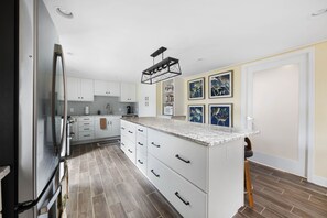 The eight-foot island is a great place to engage with activities of the kitchen