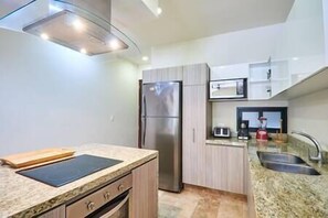 Heart of the home: Fridge, microwave, stove, oven.