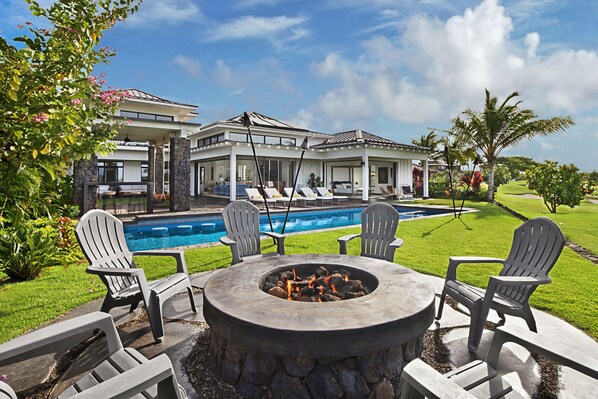 Unwind enjoying the sunset with tiki torches, fire pit & spa.