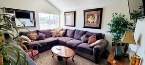 Loft on second floor set up as an entertainment area