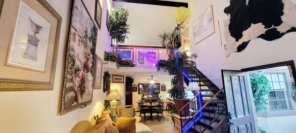 Open concept with living room connect to dining room and a staircase to a loft.