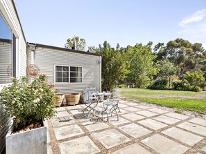 Start the day with coffee or wind down with a glass of wine on the sunny patio—your front-row seat to the peaceful countryside.