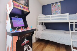 2 bunk beds, 1 sofa bed and a game machine