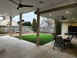 Fenced In Backyard w/ Patio dining and seating area