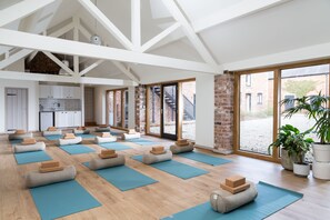 The studio space transforms into a wellness space with floor to ceiling windows