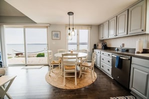 Dining by the water- Time to Eat. Fully stocked kitchen for cooking. Though you should check out The Pointe Fish and Grill located just up the road from you.