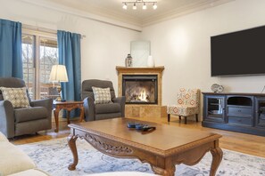 Spacious main level living area with electric fireplace