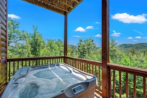 The hot tub is located on the back deck with stunning mountain views