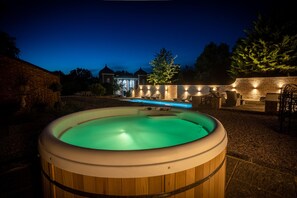 Hot tub and pool at night