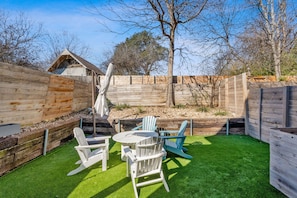Dine alfresco or lounge by the firepit in the spacious, private back yard
