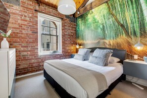 The primary bedroom features a queen-sized bed with central cooling and heating to keep temperatures comfortable. 
