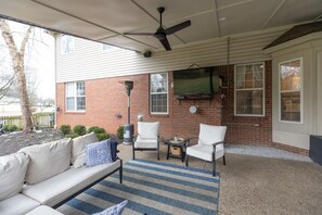 Covered Back Patio, couch, sitting chairs and 6 person dinings table 