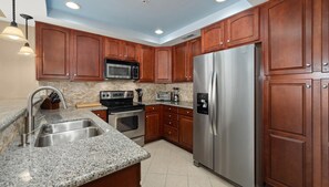 Modern kitchen with both a drip coffee maker as well as a Keurig.