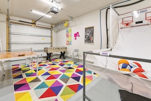 The Game room, there is a dart board on the left wall
