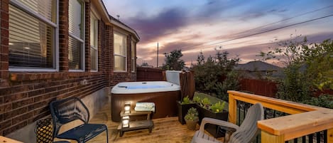 Wind down the day on the Deck featuring a 6 person hot tub, grill, and seating.