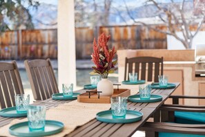 Outdoor dining at its finest with large table, grill and stunning mtn views!