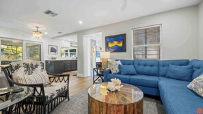 A cozy living room with plush furniture, soft lighting, and tasteful decor invites relaxation and warm conversations.