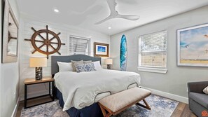 A serene bedroom adorned with soothing colors, and luxurious bedding.