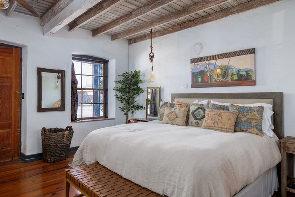 Sink into the plush bedding, featuring a king bed and rustic decor for a restful night's sleep