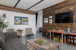 Unwind in the charming living room, a perfect spot for curling up with a good book or enjoying lively conversations with loved ones