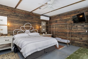 Retreat to the cozy ambiance of the master bedroom, furnished with a comfortable king-sized bed for a peaceful night's sleep.