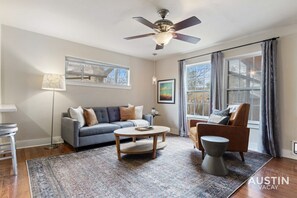 Spacious living room with sleeper sofa, smart tv, and games!