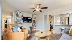 Spacious living room with sleeper sofa, smart tv, and games!