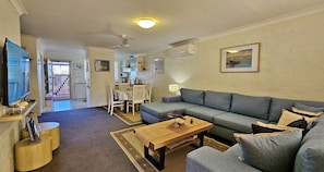 Swell Villa 6 - Kalbarri Accommodation Service - Family room view to dining and kitchen