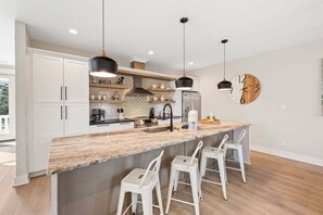 The bright open kitchen provides plenty of space for you to channel your inner MasterChef!