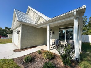 A perfect front porch to enjoy your morning coffee.