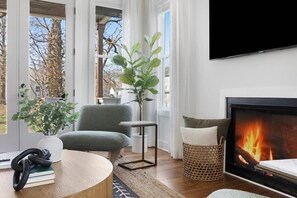 Warm Living Room with Fireplace and Comfortable Sofas